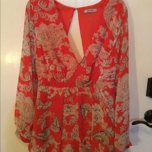 Deep V floral long sleeve romper.